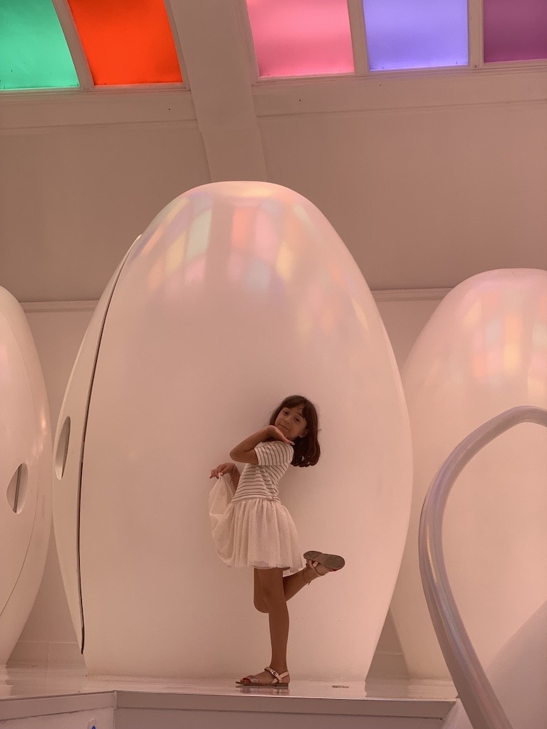 Iridescent egg pods under coloured skylights